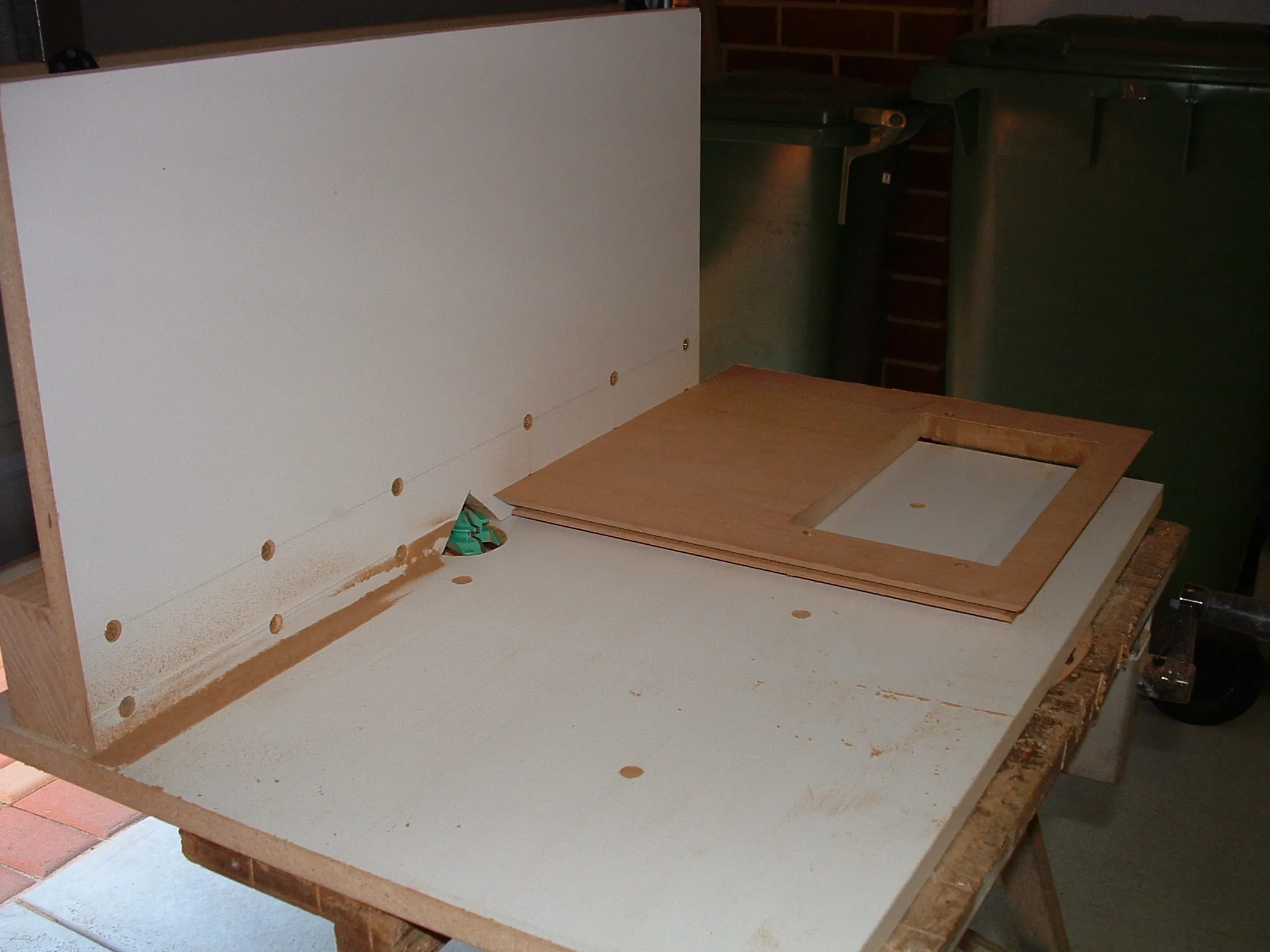 Lock miter joint routing: jig or fence on table saw for cabinet corners.