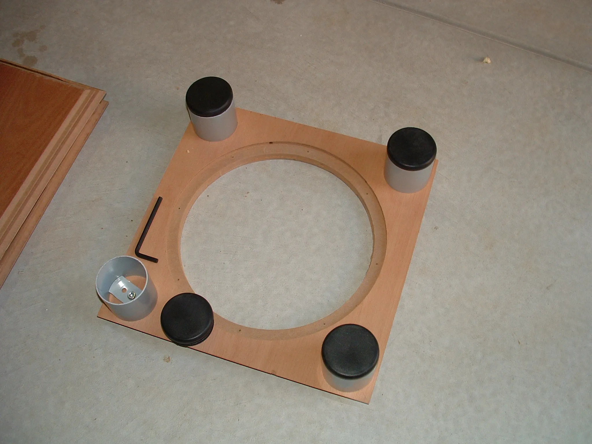 DIY subwoofer project: cabinet pieces on work surface.