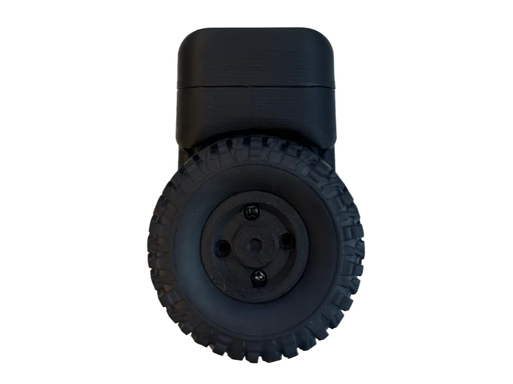 Side profile of the self-balancing robot: large knobby RollerCAN wheel with printed hub, vertical 3D-printed body, and rounded top cap on a white background.